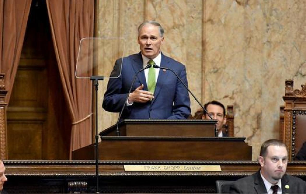 Governor Jay Inslee speaking at podium (Office of the Governor/Flickr)