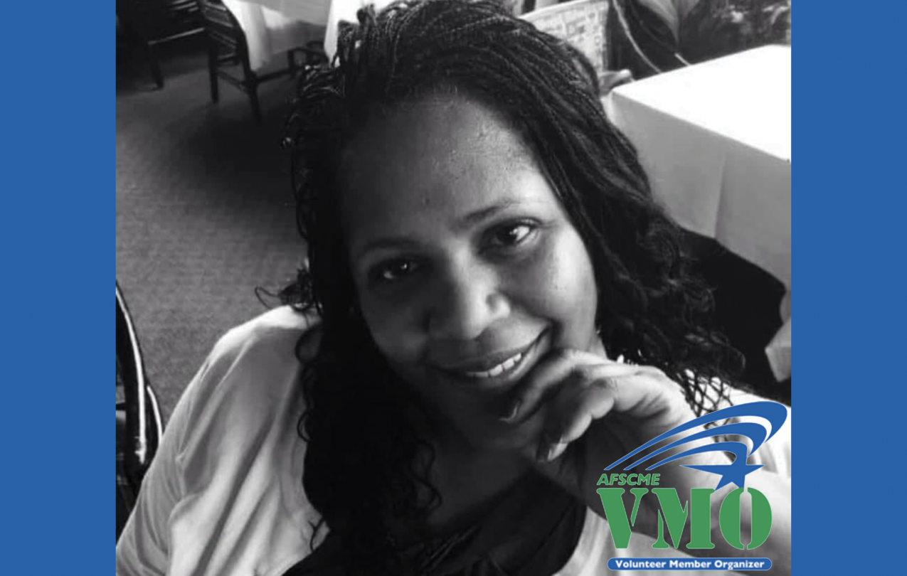 A black and white photo of WFSE member Karen E Johnson, bordered by blue bars to the left and right with an overlay that reads "ASFCME VMO Volunteer Member Organizer"