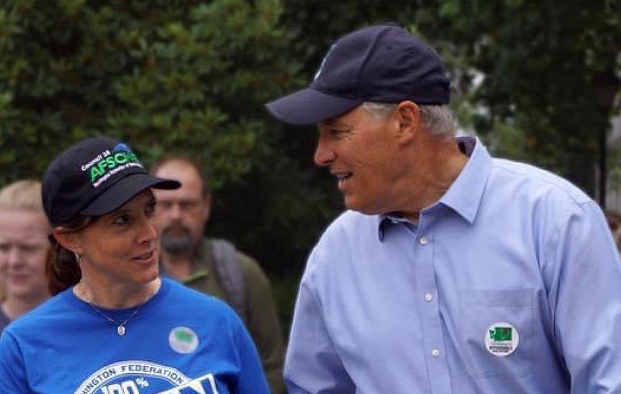 WFSE Executive Director Leanne Kunze and WFSE members walk with Governor Jay Inslee.