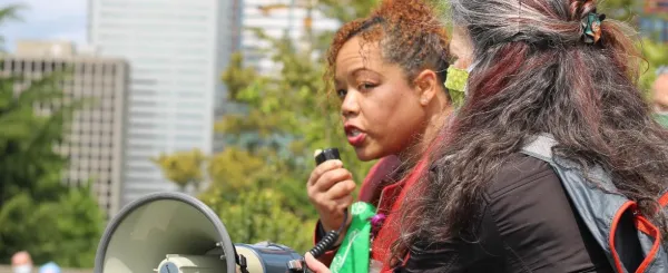 Photo of a woman with a megaphone