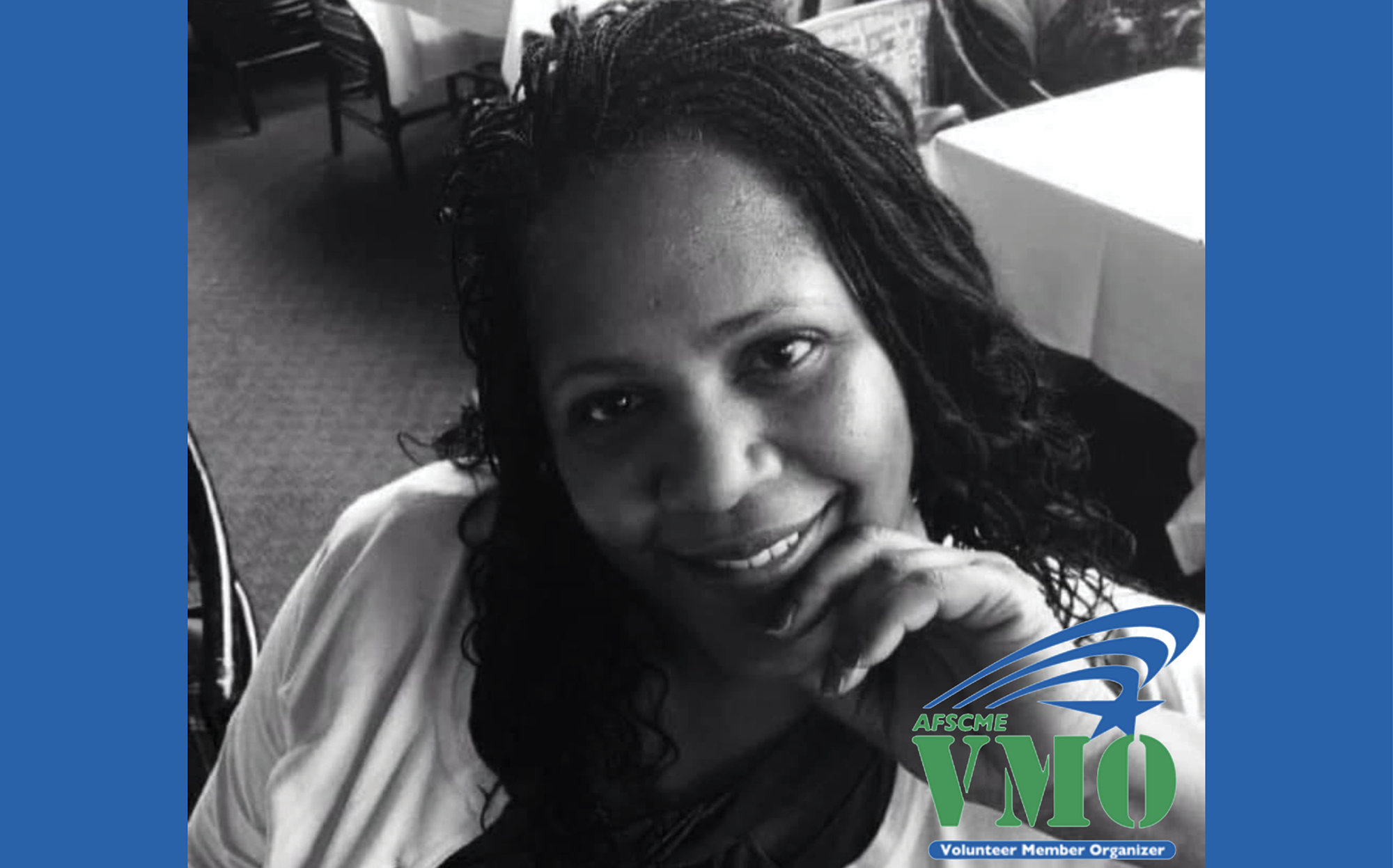 A black and white photo of WFSE member Karen E Johnson, bordered by blue bars to the left and right with an overlay that reads "ASFCME VMO Volunteer Member Organizer"